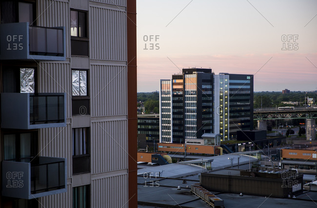 Quebec - July 24, 2020: An office building near the Longueuil metro station at dusk. QC, Canada