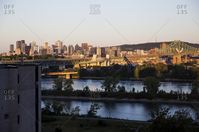 Quebec - July 24, 2020: A view of the Montreal skyline at sunrise, seen from Longueuil, QC, Canada