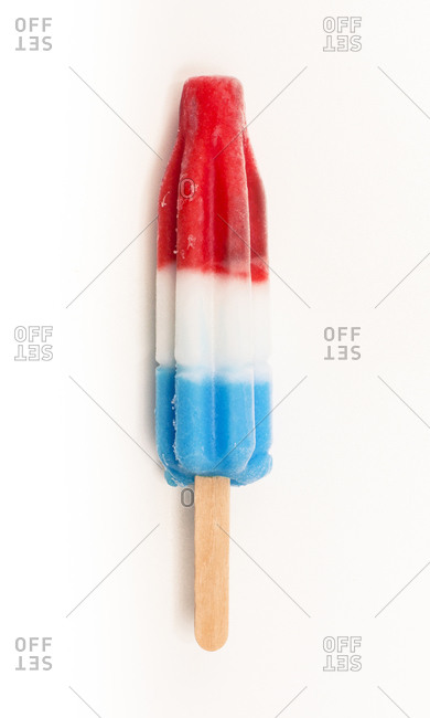 Red, white and blue popsicle on white background