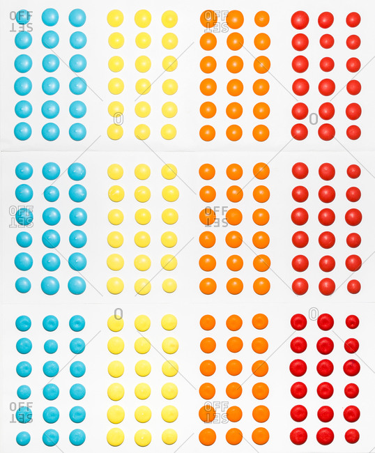 Colorful candy dots on white background