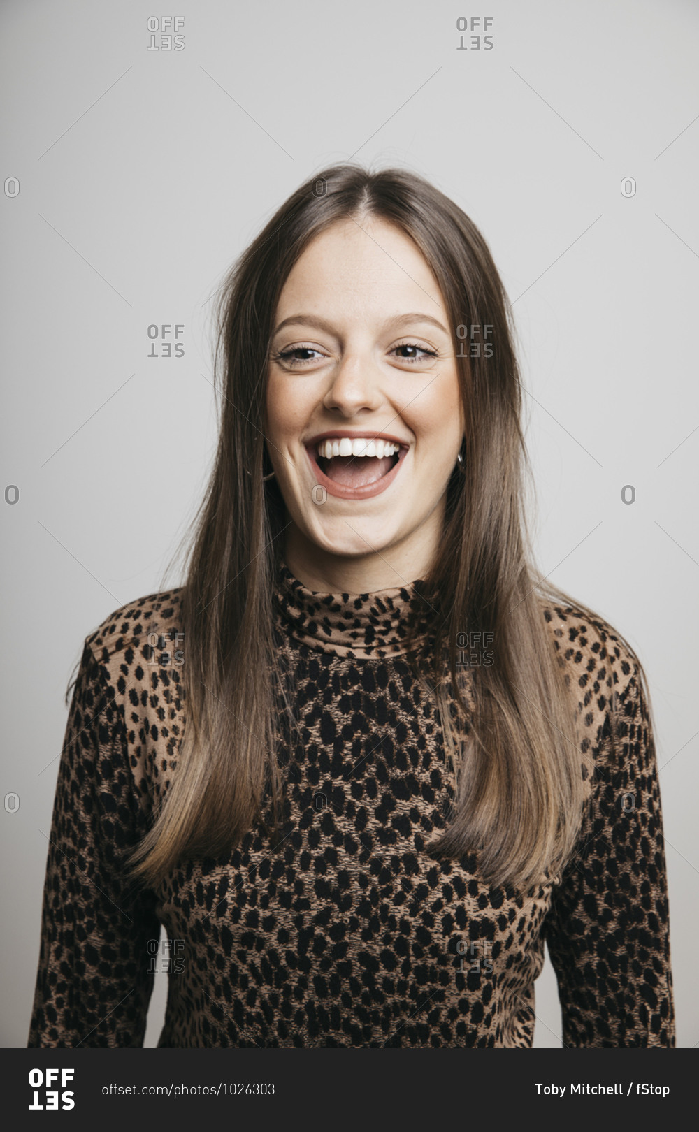 Portrait of happy young brunette woman