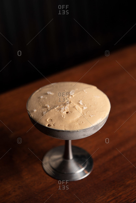 Salted caramel ice cream in stainless steel dish