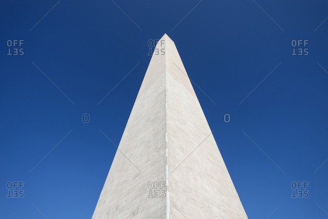 Low angle view of the Washington Monument under clear blue sky in Washington, D.C.