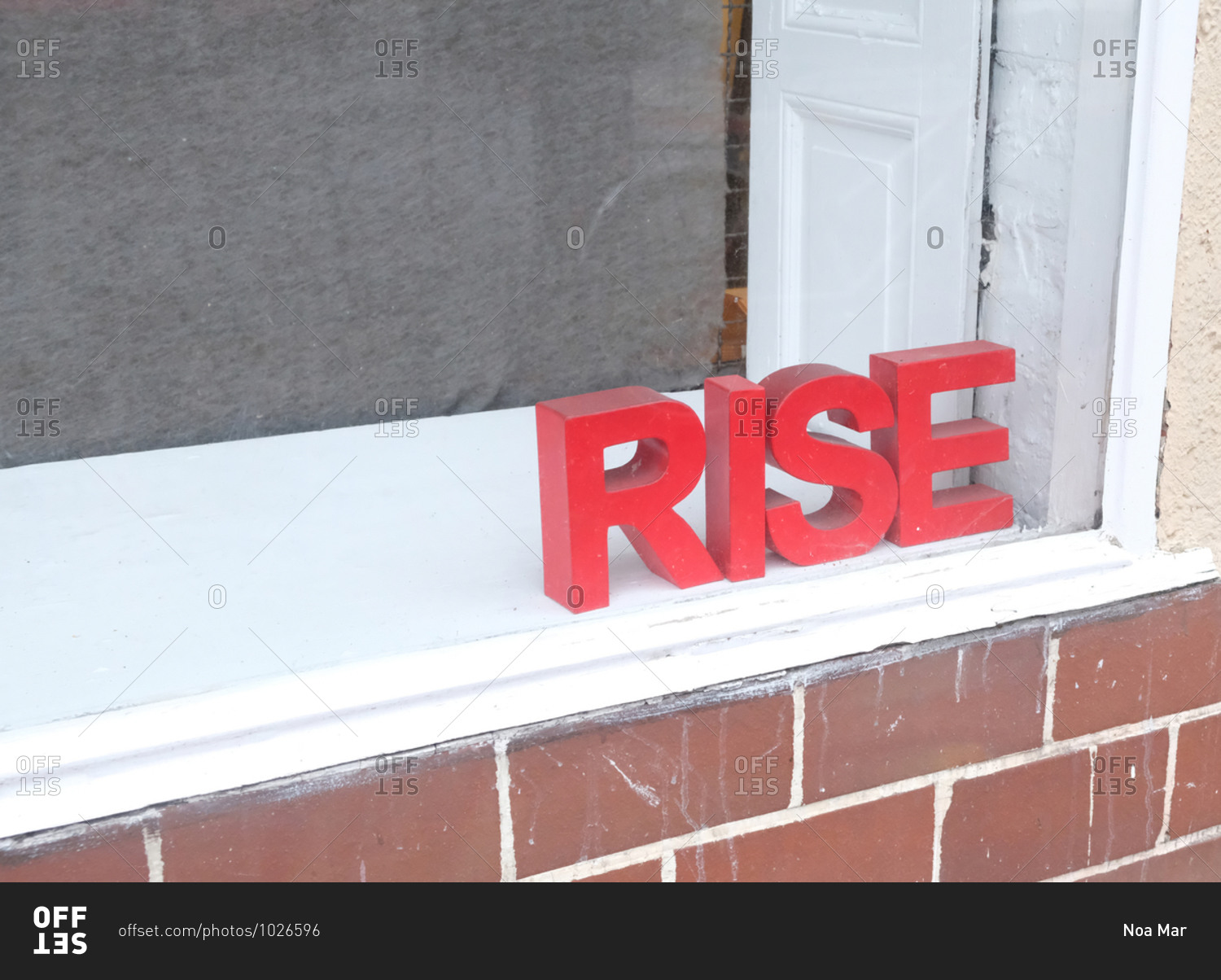 Red Rise sign on windowsill