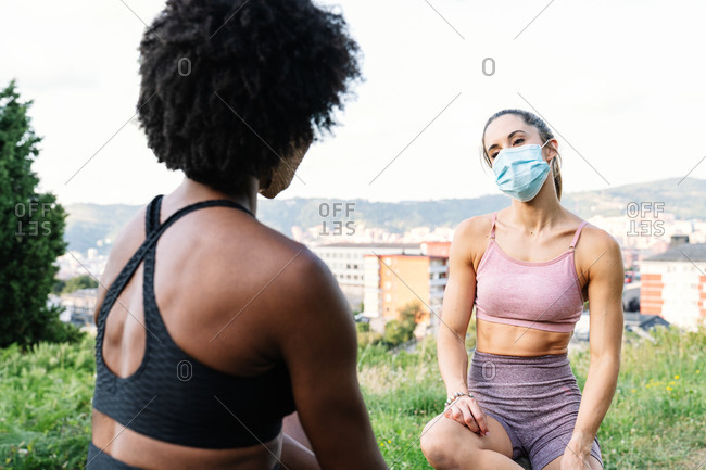 Young fit athletic women flexing their abs, wearing turquoise sports  clothes Stock Photo - Alamy