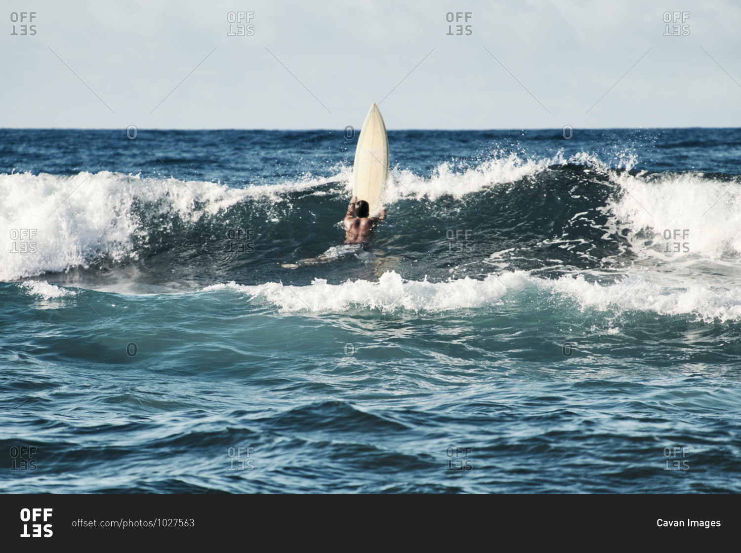 Man Surfing With A Yellow surfboard