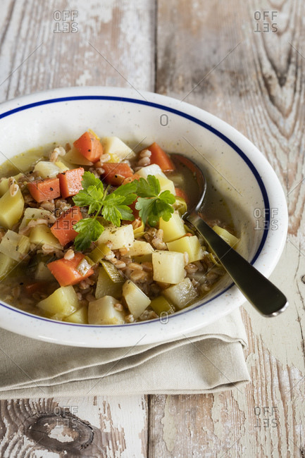 Bowl of ready-to-eat vegan vegetable stew with emmer wheat