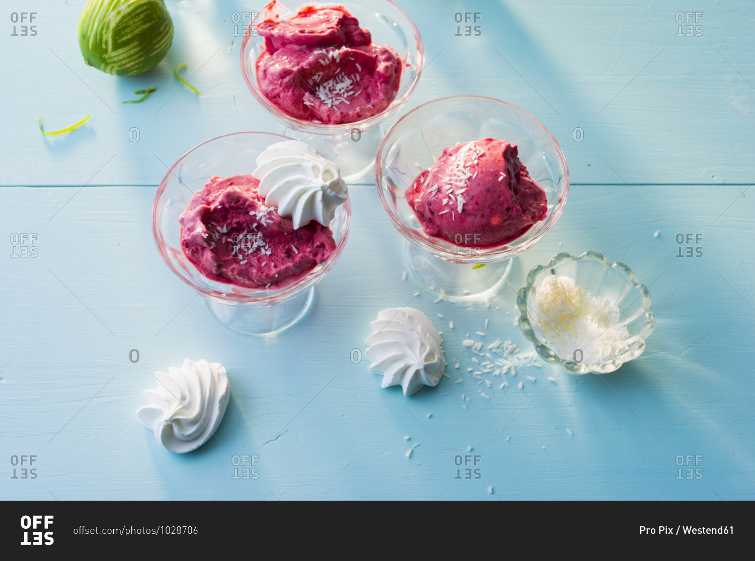 Raspberry ice creams with coconut shreds and meringues