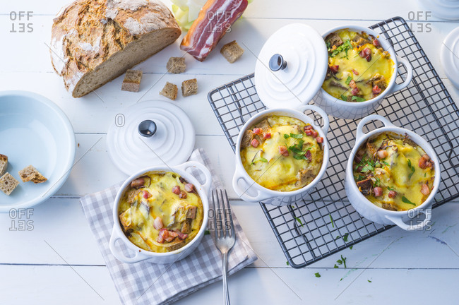 Bowls of bread soup with bacon and cheese
