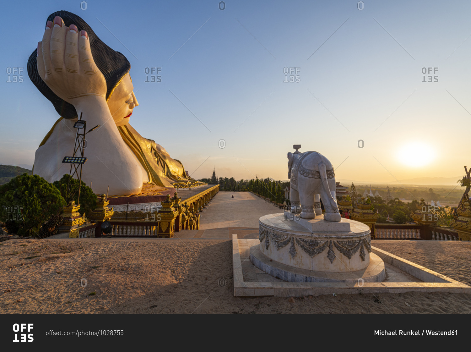 Myanmar- Mon State- Giant statue of reclining Buddha in Pupawadoy Monastery at sunset