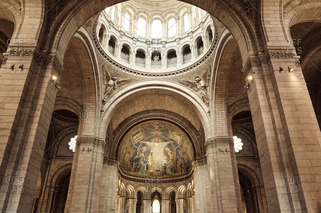May 16, 2019: Europe, France, Paris, Montmartre, Sacre Coeur, Cathedral from inside, illuminated window