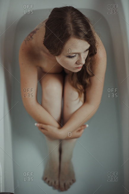 Woman relaxing in bathtub - Offset