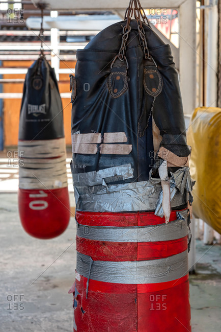 September 4, 2019: Dirty and torn punching bags in a boxing school. Havana, Cuba