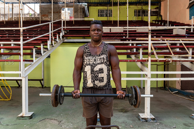 September 4, 2019: Boxer lifting weights in a gym. Havana, Cuba