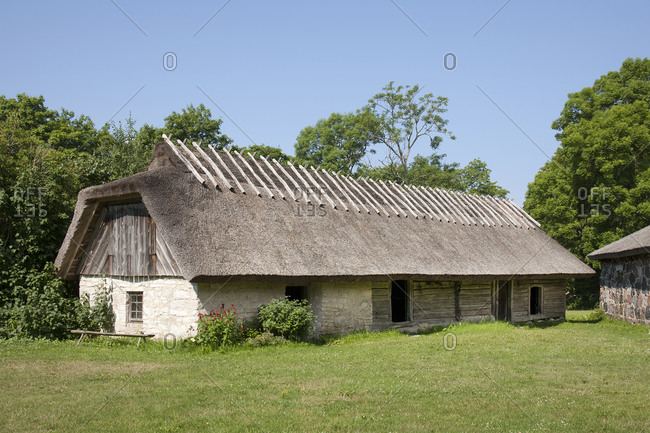 Muhu Museum Exterior in Estonia, a barn with a thatched roof.