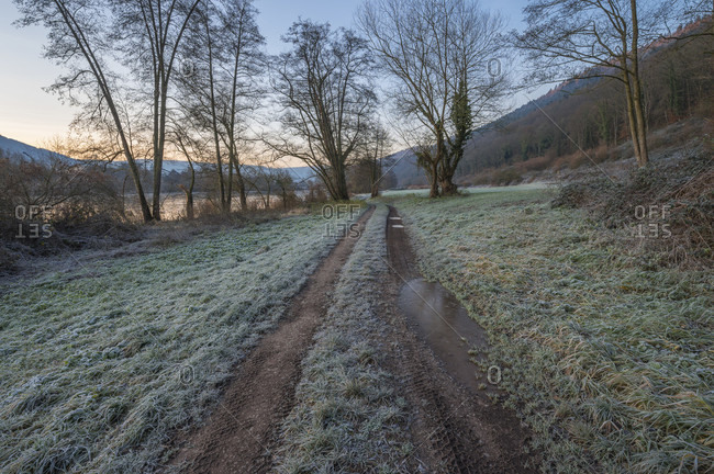 Dirt road at sunrise in winter, Bernstadt, miltenberg, churfranken, spessart, Franconia, bavaria, Germany