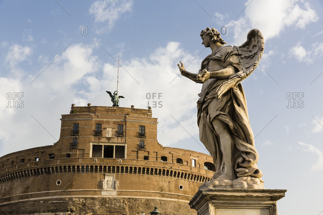 Castle sant\' angelo and angle statue on ponte sant\'angelo