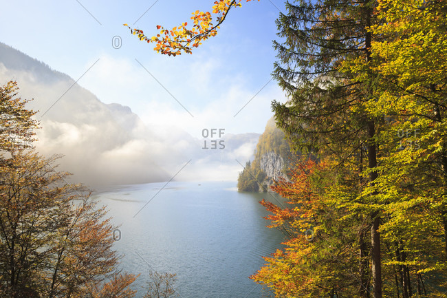 Lake koenigssee in autumn seen from malerwinkel on a foggy morning