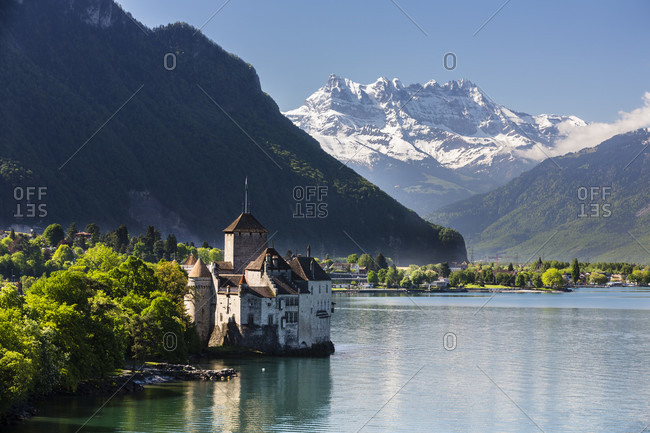 Chateau de chillon on lac leman (lake geneva) in front of the dent du midi, spring