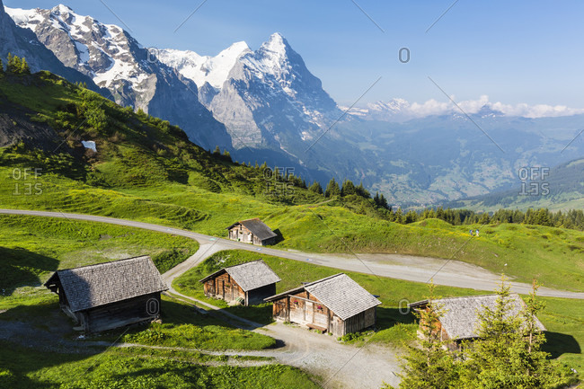 Group of wooden barns in front of mount eiger, grosse scheidegg, bernese alps, unesco world heritage site
