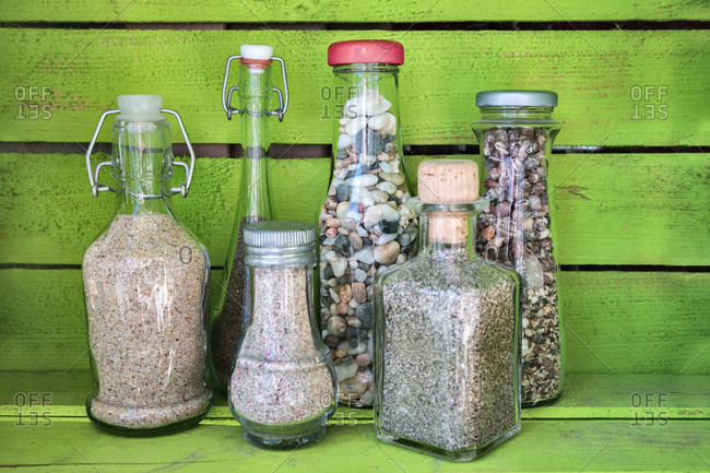 Sea sand in glass bottles, souvenirs from summer holidays
