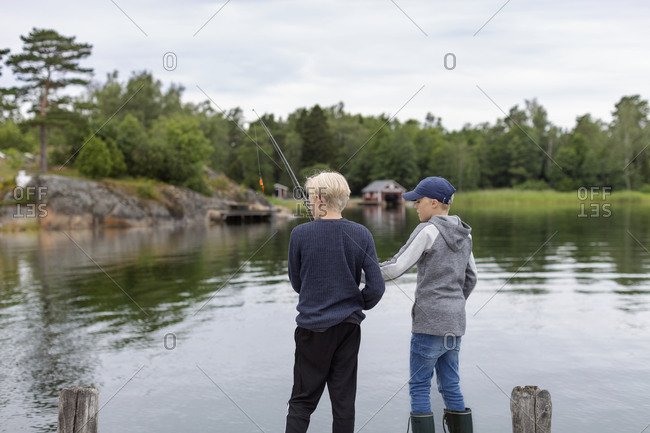 Boys fishing at lake