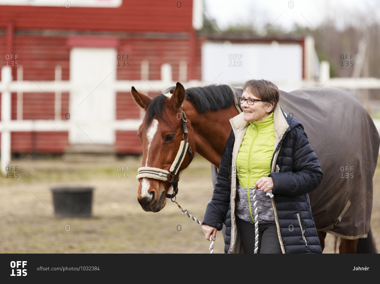 Smiling woman with horse
