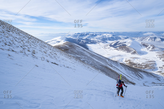 Young man hiking on Sibillini mountain against sky- Umbrian- Italy