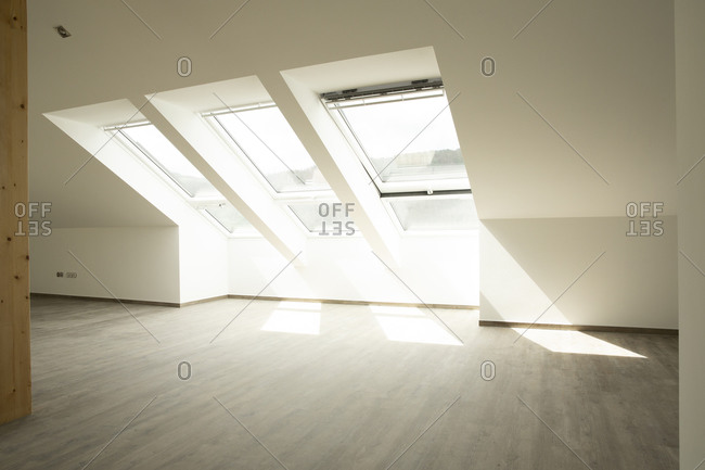 Sunlight falling through windows on floor in new house