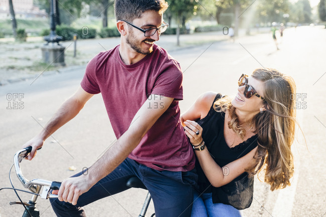 couple bicycle riding stock photos - OFFSET