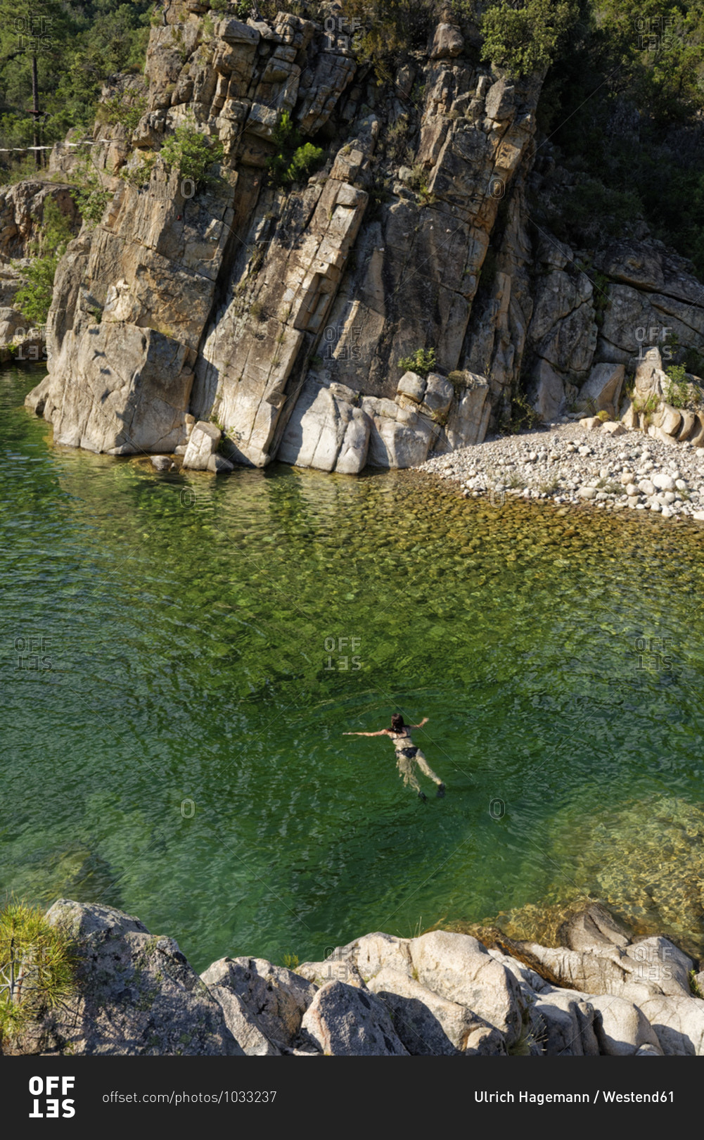 Woman swimming in Solenzara river