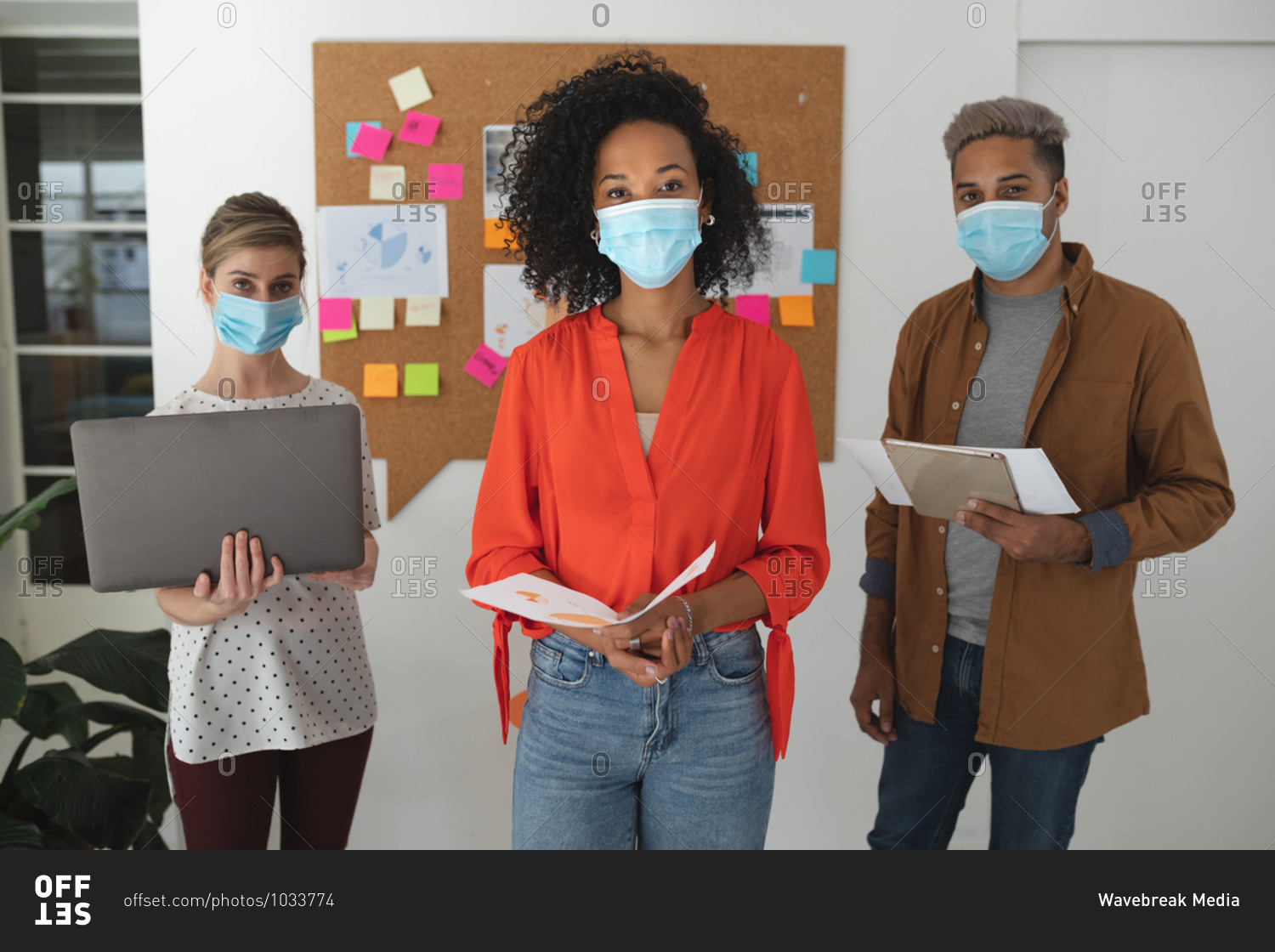 Portrait of multi ethnic group of male and female creative business ...