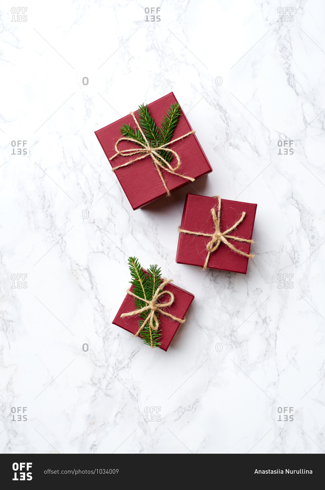 Top view of wrapped and decorated gifts and boxes with presents on marble background
