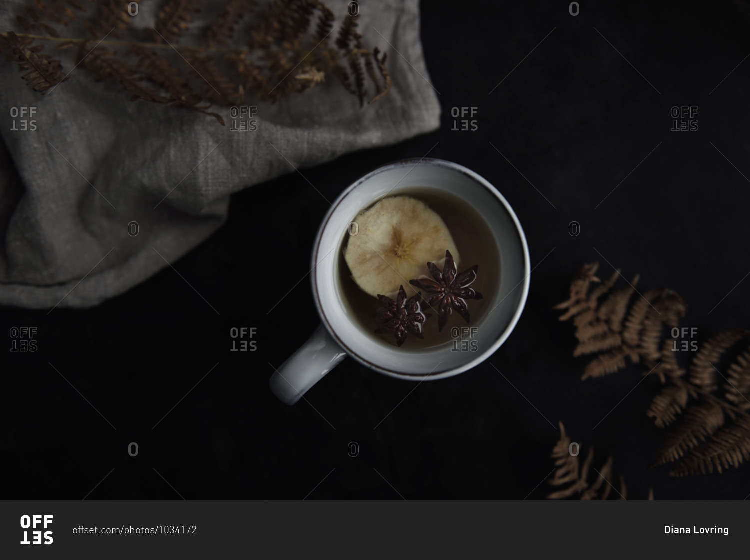 Apple tea in mug on black table