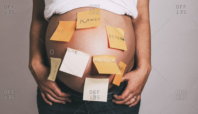 Portrait of a beautiful pregnant woman wearing a saree stock photo - OFFSET