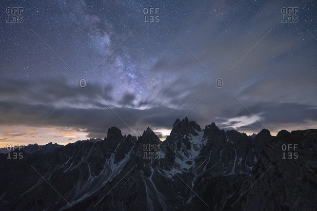 Milky Way and stars over the sharp pinnacles of Cadini di Misurina, Dolomites, Belluno province, Veneto, Italy, Europe