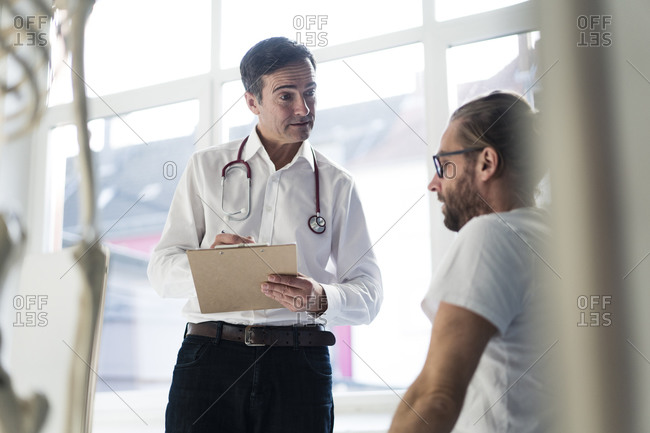 Doctor talking to patient in medical practice