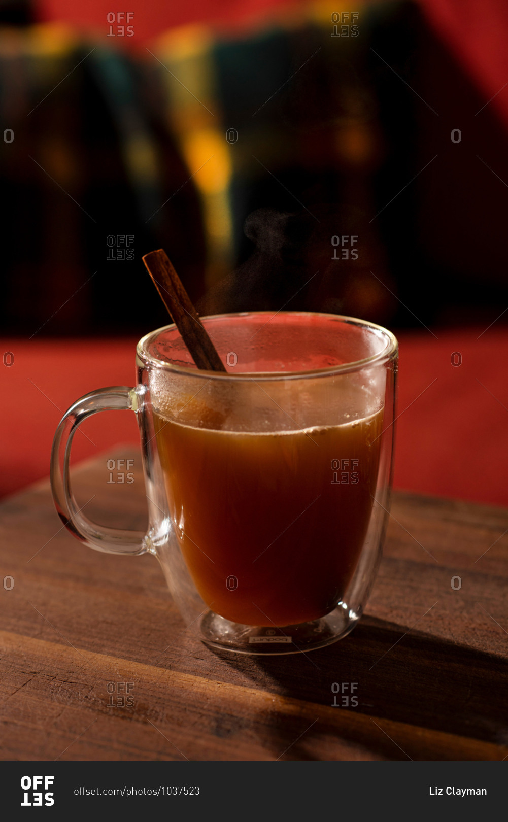 Close up of a glass of mulled apple cider and orange cocktails