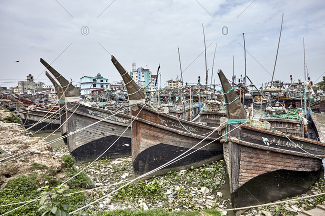 Chittagong, Bangladesh - May 13, 2013: Large old ships and boats anchored at Chaktai Khal on the River Karnaphuli