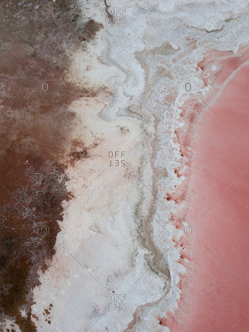 Beautiful aerial wide vibrant view of a pink salt lagoon in Spain