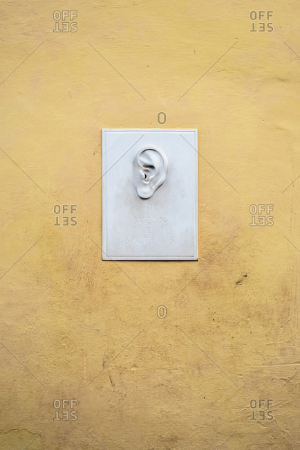 August 24, 2019: Ear on a wall with the inscription "Mailbox of secrets". Trinidad, Cuba