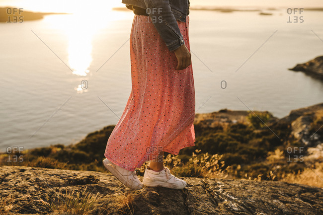 Low view of woman walking at sea