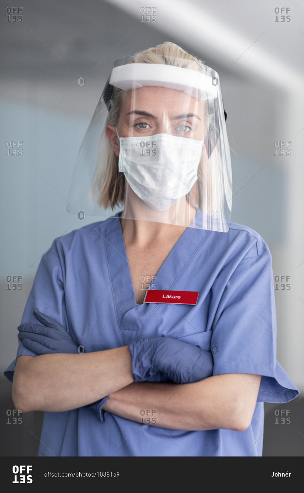Female doctor wearing face shield. Detailed shot.
