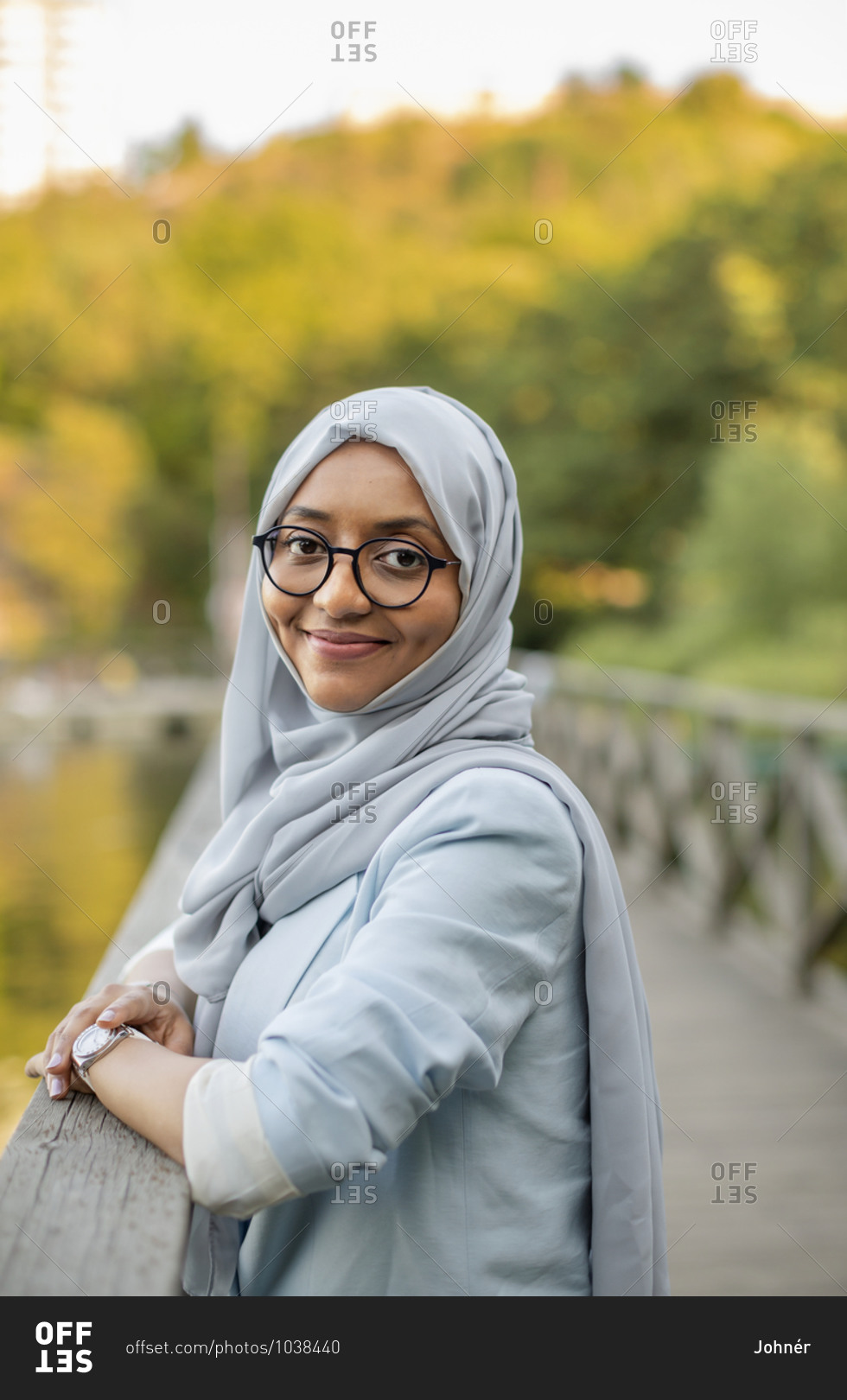 Smiling woman wearing hijab looking at camera