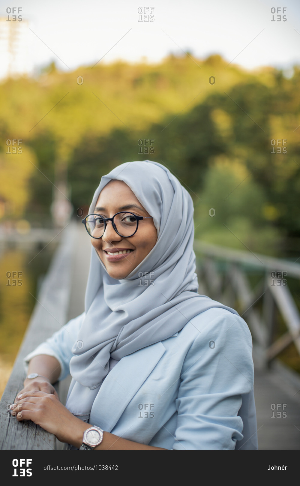 Smiling woman wearing hijab looking at camera