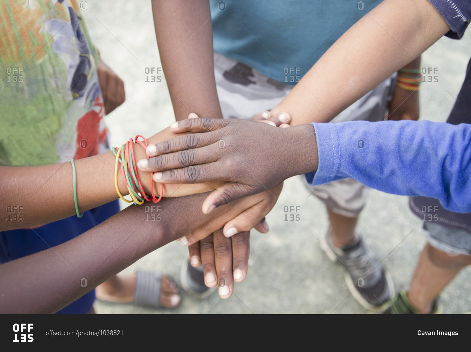 Anonymous group of children of various ethnicities putting their hands together