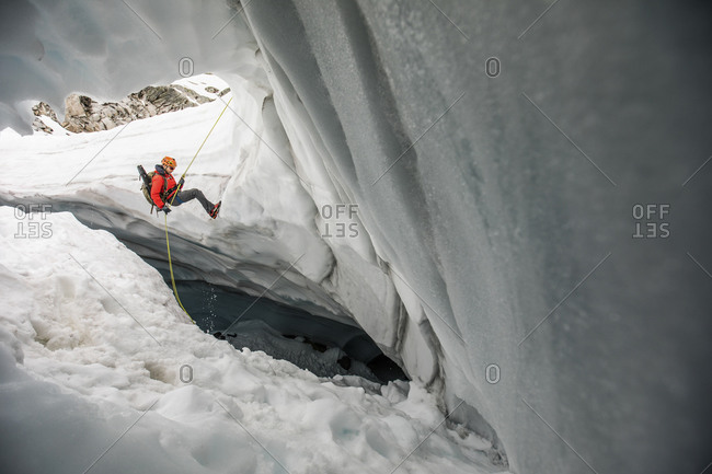 Mountaineer rappels into glacier crevasse to search for lost hikers
