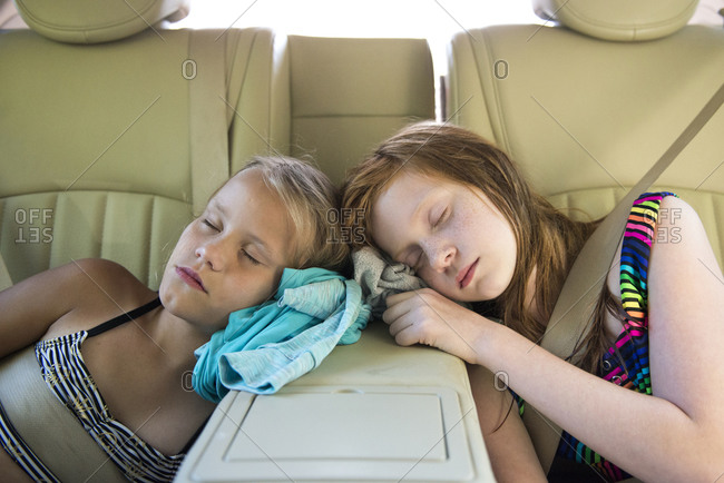 Two Young Girls Asleep in Car After Playing