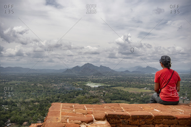 Woman enjoying the view from the top of the Sigiriya rock fortress