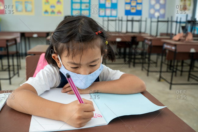 Kids wearing mask protect and safety from corona virus in classroom